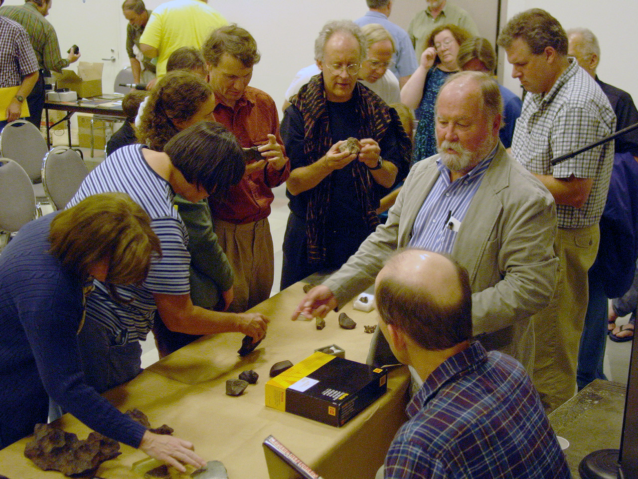 Dick explaining meteorites to crowd at OMSI 2002